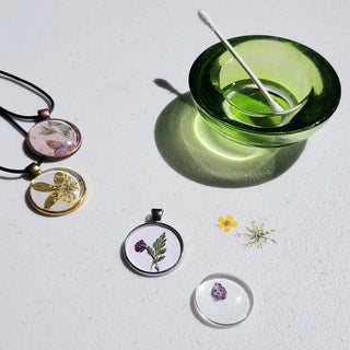 Necklace making fused glass project. Circular pendant formed with small flowers