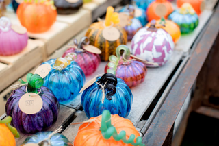 Display of glass pumpkins outdoors