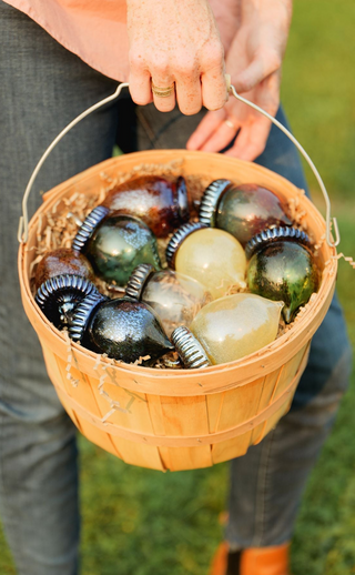 Basket of glass acorns