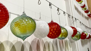 Hand blown glass holiday ornaments on display